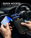 Black slim wallet with pop-up card access, shown in a car with multiple cards for fast, easy everyday use.